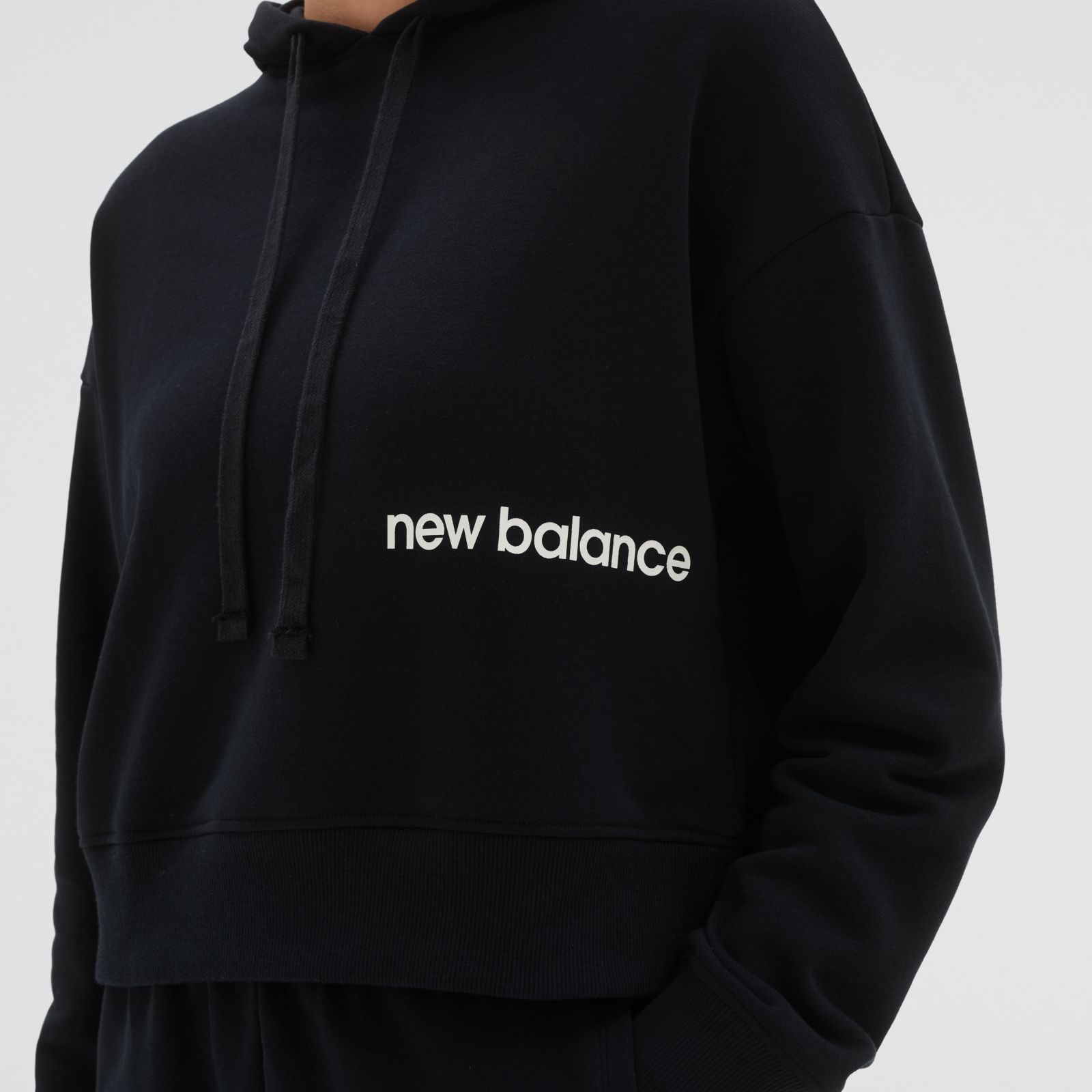 Buzo mujer New Balance Essentials WT23512