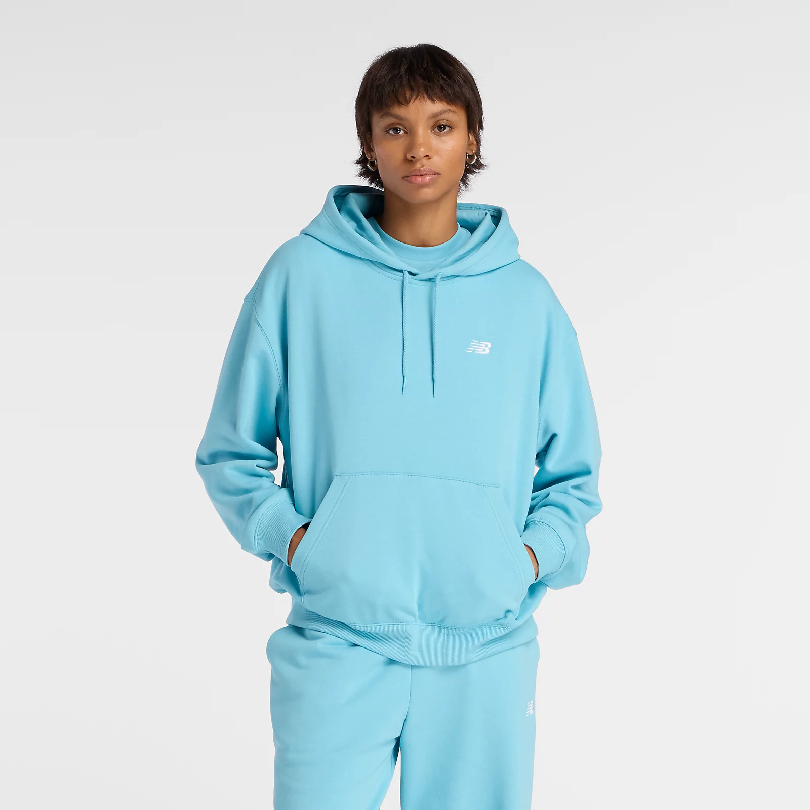 New Balance Buzo Sport Essentials French Terry Hoodie WTA41507, Turquesa, swatch